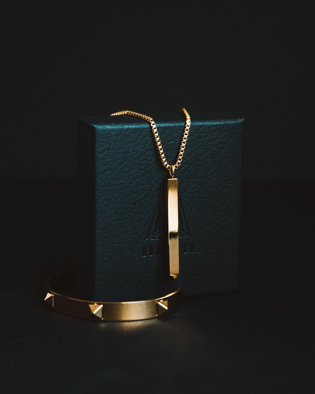 Gold-coloured pendant necklace on display, natural stone pendant reference — placeholder image