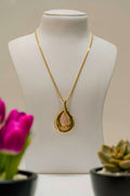 Necklace displayed on a mannequin with soft floral background, pearl-style jewelry reference — placeholder image
